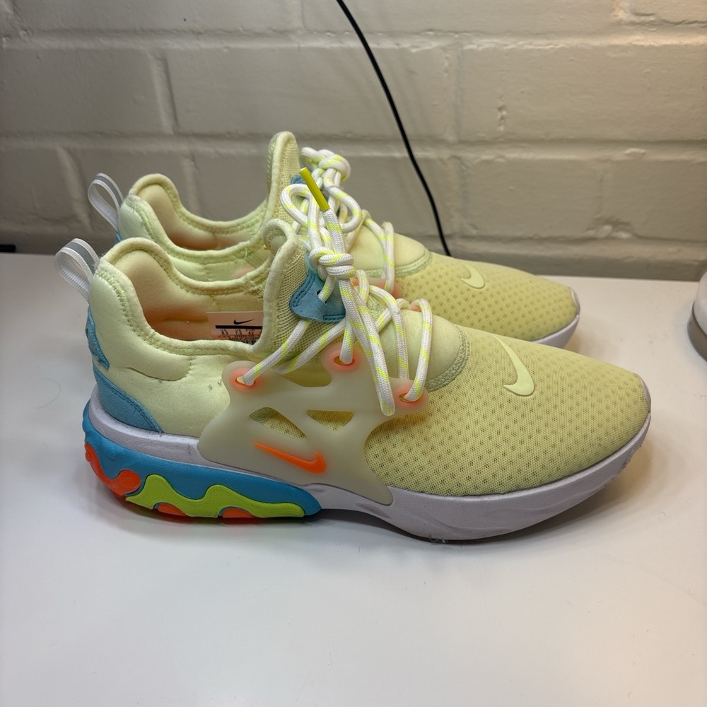 Nike Wmns React Presto "Psychedelic Lava" sneakers with a barely volt upper.